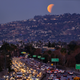 A super blue blood moon is seen setting behind the Hollywood hills in Los Angeles.